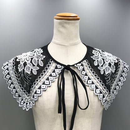 Embroidered black and white shoulder cape