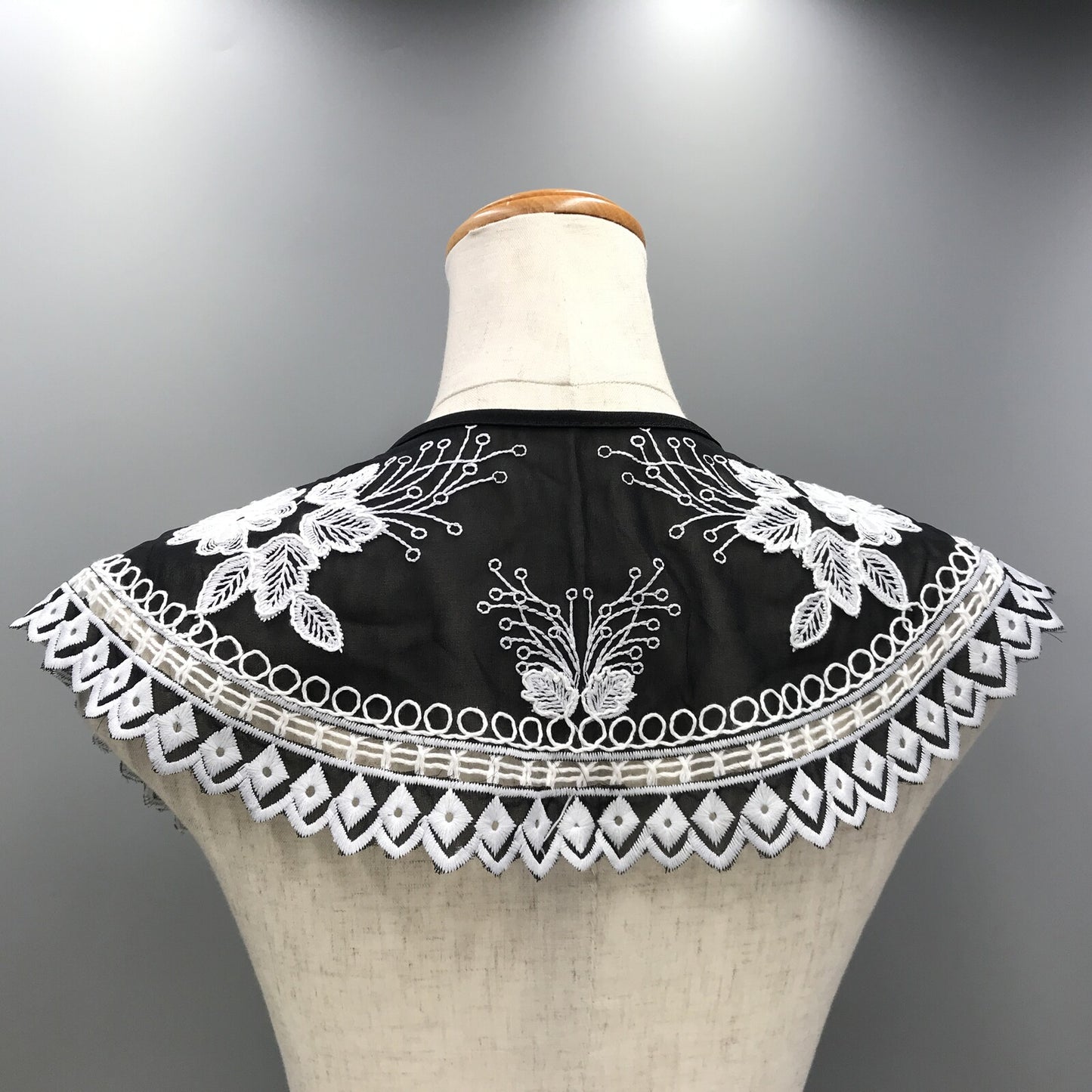 Embroidered black and white shoulder cape