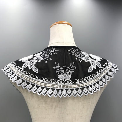 Embroidered black and white shoulder cape