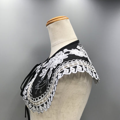 Embroidered black and white shoulder cape